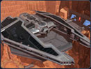 The dark form of the Sith Fury dominates the scene from its perch on a landing pad in one of Korriban’s red-rock canyons.